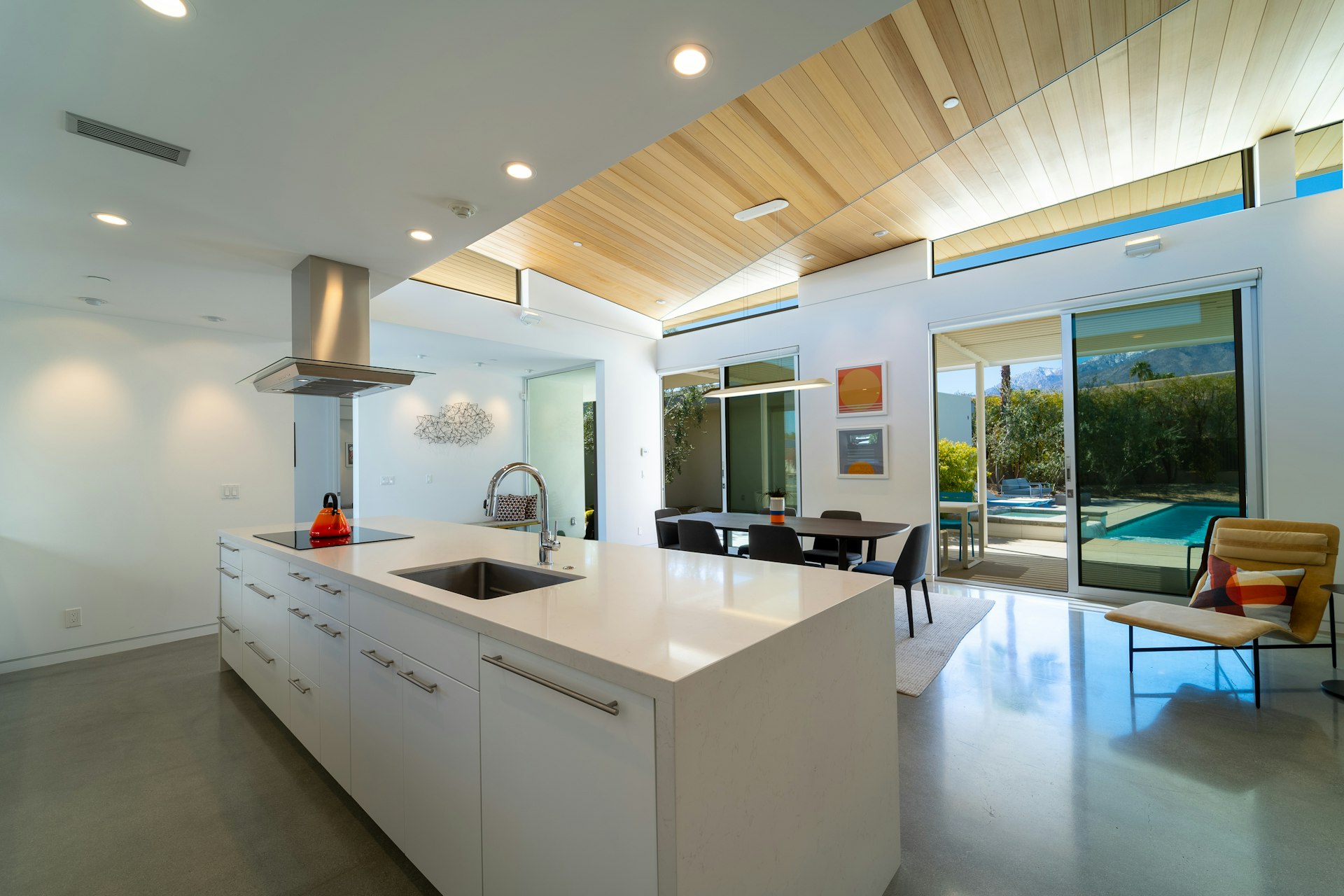 a modern kitchen with a large island in the middle of the room